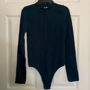 Long Sleeve Bodysuit With Crop in the Back.